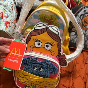 Loungefly McDonald's Sesame Street Character Mini Backpack in Yellow, Pink, Blue